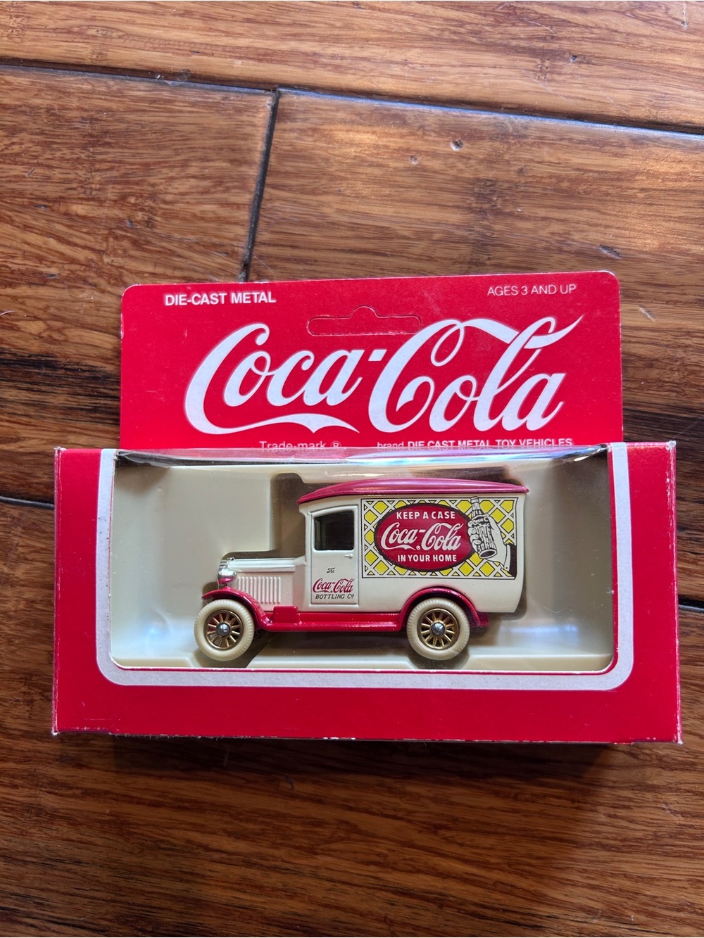 Vintage Coca-Cola die cast metal vehicle. “Keep a Case in Your Home”.